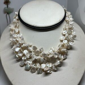Triple strand genuine keshi freshwater pearl necklace. Sterling silver toggle